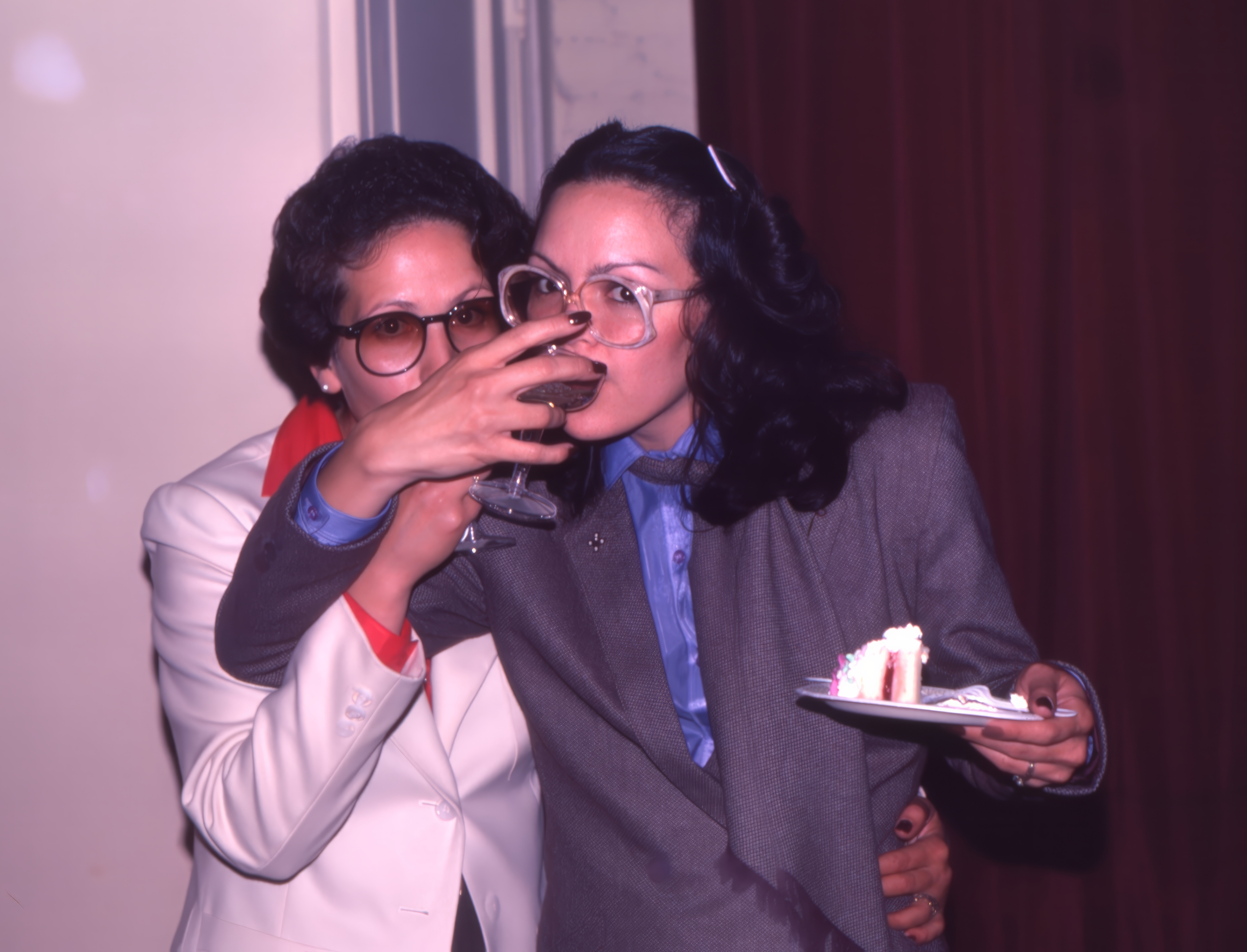 After the liturgy, a newly united couple shares wine and cake at the reception celebrating their Holy Union. Such gatherings were an integral part of the Church of the Beloved Disciple's ministry, affirming same-sex relationships not only through sacramental rites but also through the communal rituals of hospitality, fellowship, and joyful celebration that traditionally followed Christian weddings.