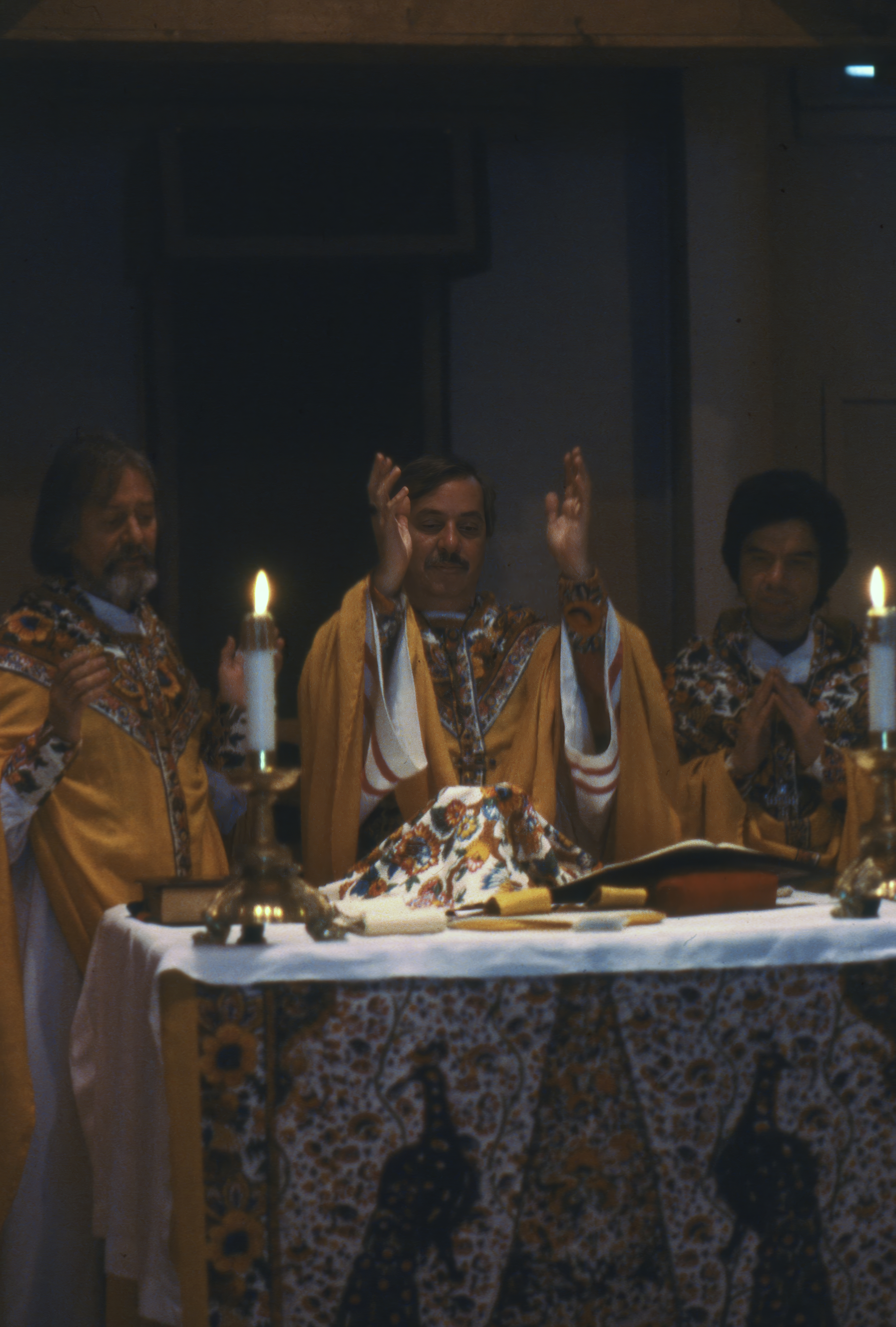 Father John Noble (left), Bishop Robert Mary Clement (center), and Father Leo M. Joseph (right) celebrate a special Eucharist in honor of New York City's annual Gay Pride March in June 1975. For the Church of the Beloved Disciple, the Mass was both a preparation for public witness and an affirmation that LGBTQ identity and Catholic faith were inseparable.