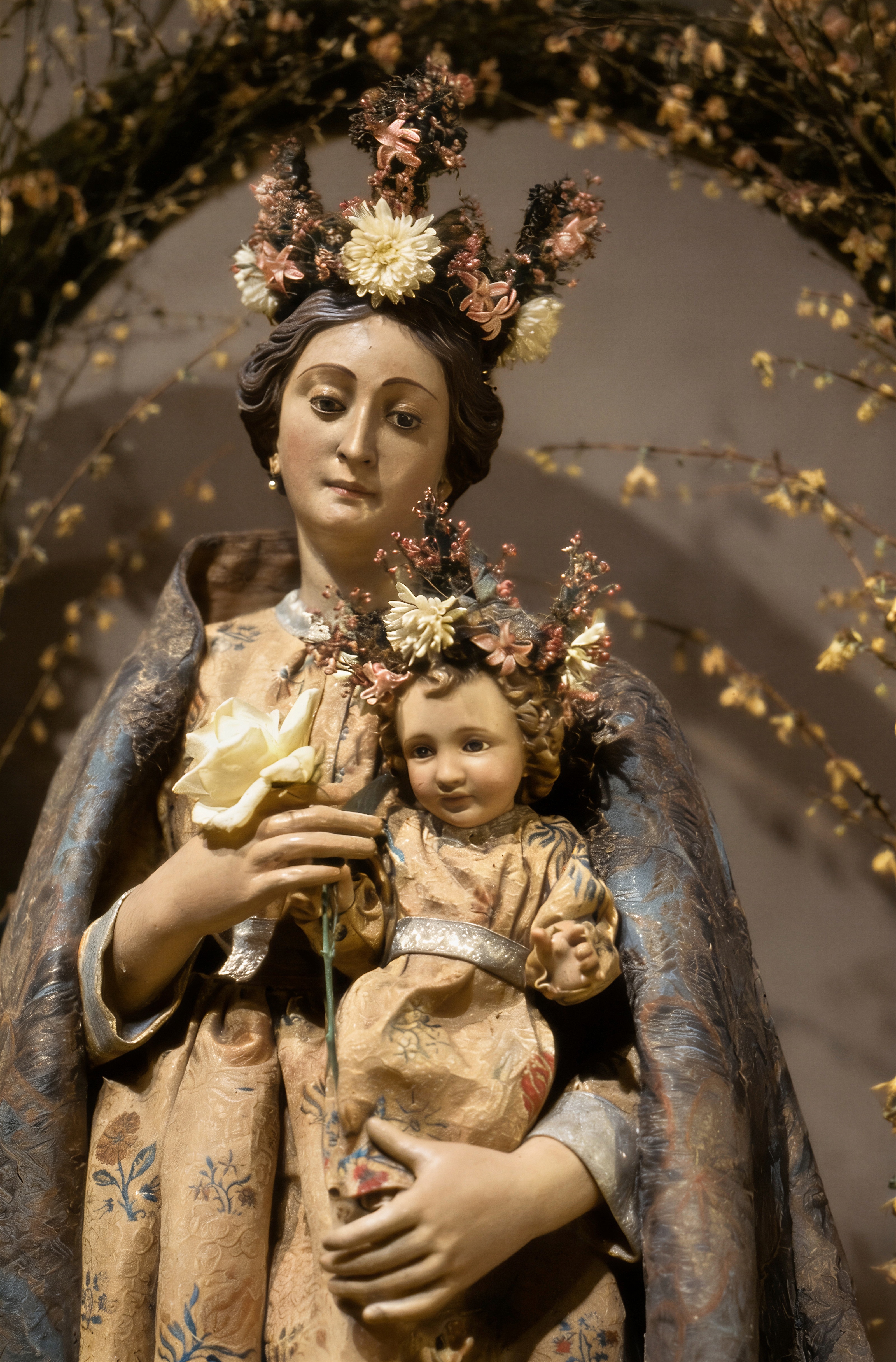 This restored view depicts the Church of the Beloved Disciple's principal Marian statue holding the Christ Child, both crowned with floral wreaths for a feast day celebration. The image occupied a place of honor within the sanctuary and was carefully decorated by members of the congregation as an expression of reverence and beauty. It served as a focal point for prayer throughout the liturgical year and accompanied the parish during outdoor Marian processions through the streets of Manhattan.