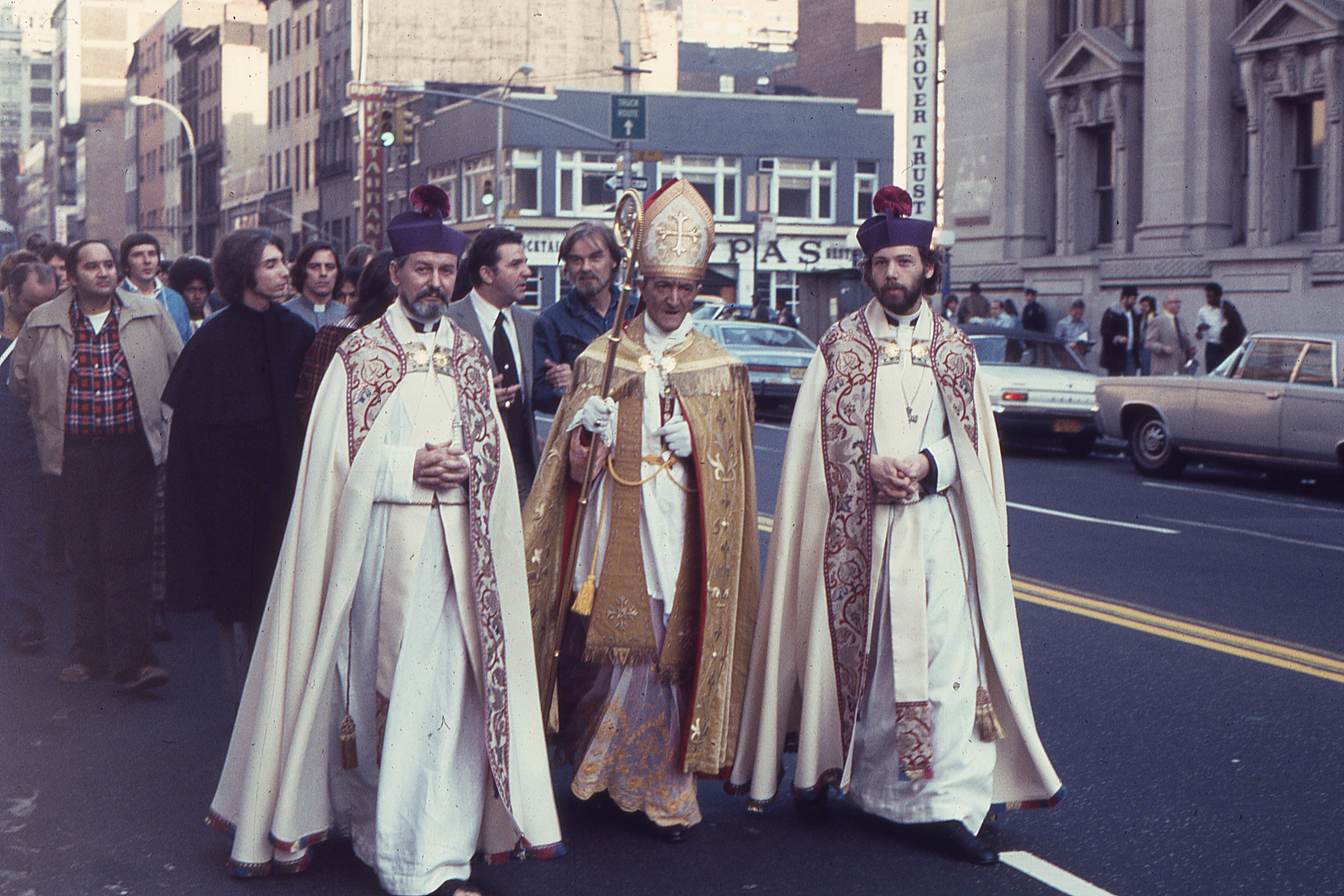 Archbishop Richard Arthur Marchenna, Primate of the Old Roman Catholic Church in North America and principal consecrator of Bishop Robert Clement, walks between Father Leo (left) and Father John Darcy Noble (right) during the procession to the Church of the Beloved Disciple.