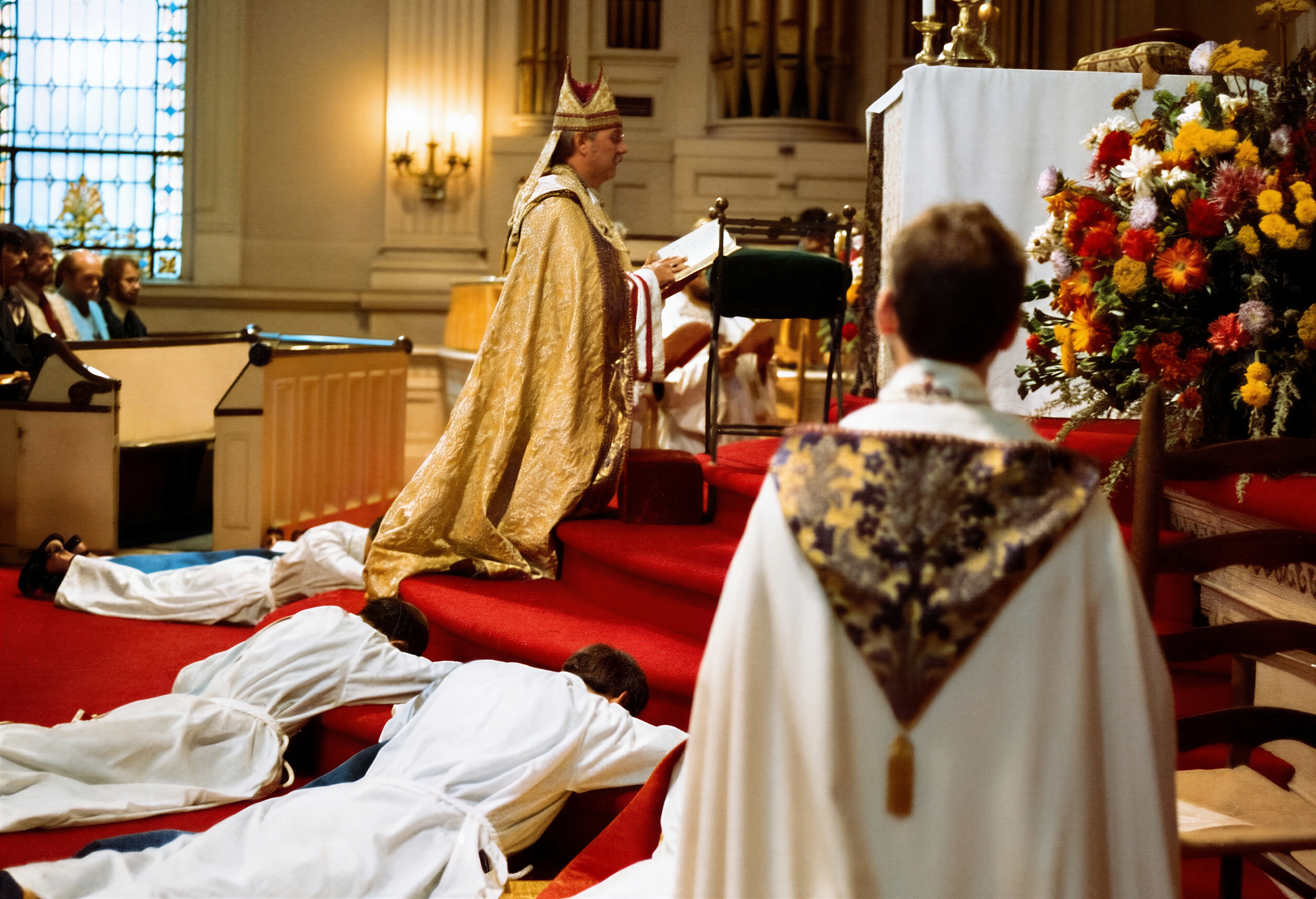 Bishop Robert Mary Clement ordains five priests for the Church of the Beloved Disciple during a liturgy in New York City on October 2, 1978. The ordinands—Fathers Mark, Paul, Victor, Gabriel, and Philip—were called to continue the church's ministry of serving LGBTQ Christians after having experienced rejection or exclusion from other Christian traditions. Their ordinations reflected the Church of the Beloved Disciple's commitment to cultivating an openly gay clergy and ensuring the continuity of its sacramental and pastoral mission.